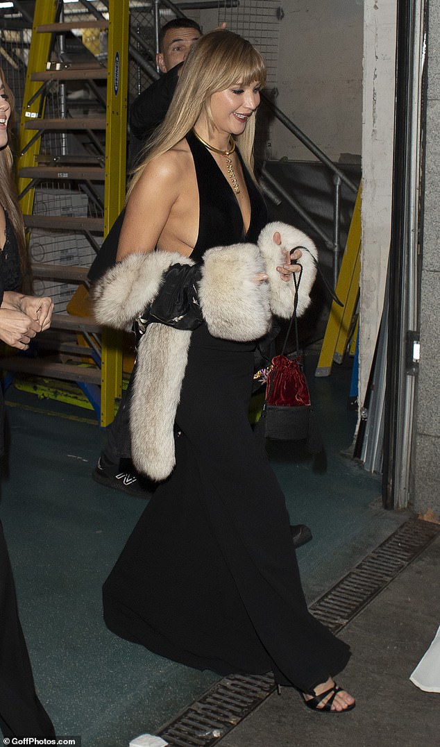Jennifer looked in good spirits prior to the premiere as she left her hotel carrying a black jacket with a shearling collar and cuffs