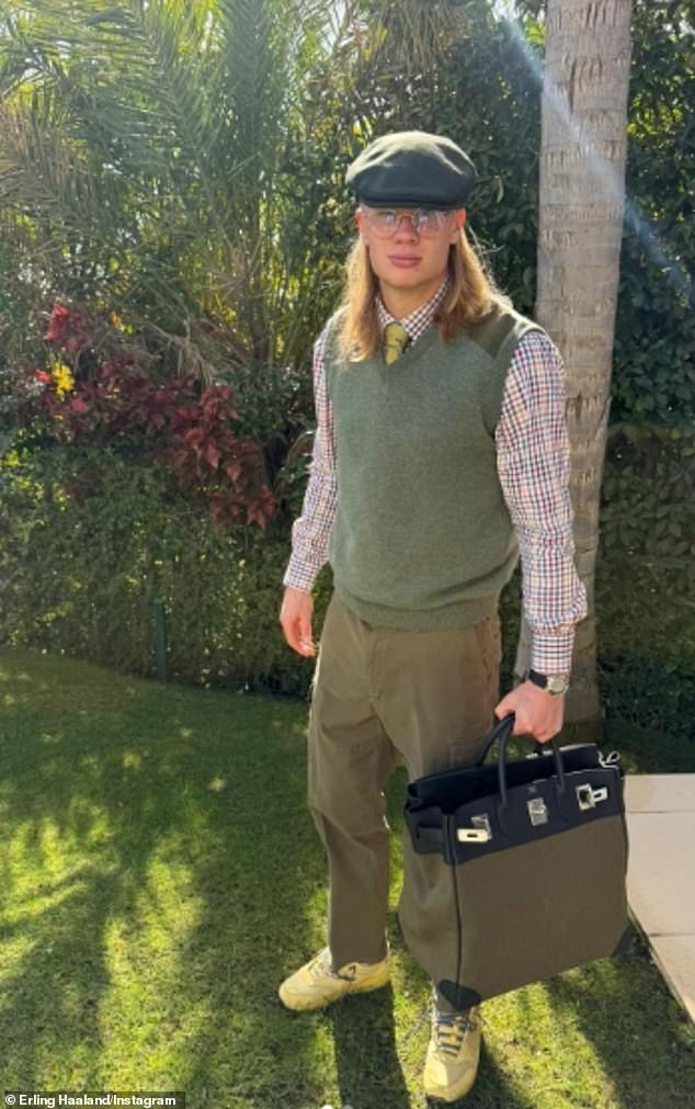 Erling Haaland posed with a flat-cap on his head while carrying a £9,500 Birkin bag by his side
