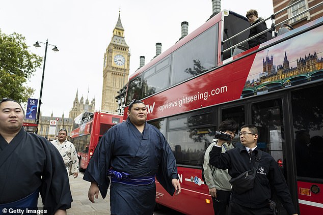 Sumo wrestler Onosato (centre) was spotted walking near Big Ben in central London on October 14, 2025