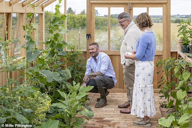 This oasis of peace has given him an opportunity to seek the ultimate solace ¿ and grow the garden he never had as a small boy. Pictured: Sir David Beckham, photographed at home in Oxfordshire with Mark Hedges (Editor in Chief) of Country Life magazine and Paula Minchin (Co-ordinating editor of the Sir David Beckham Guest Issue)