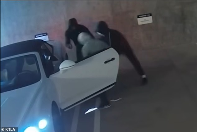 The attack, captured on surveillance cameras, shows three masked men blocking the victim's pristine white Bentley and dragging him to the ground