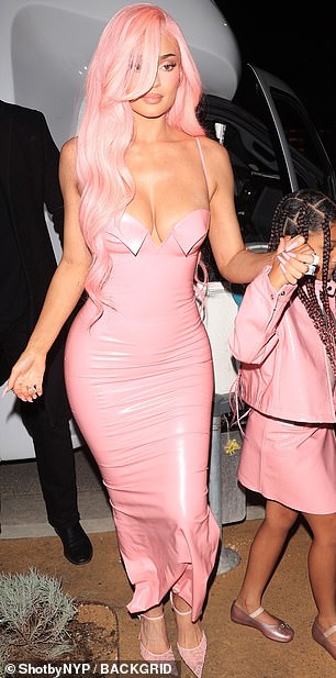 Kylie opted for minimal accessories to allow her outfit to be the main focal point and added a pair of mini earrings and a few flashy rings on her hands