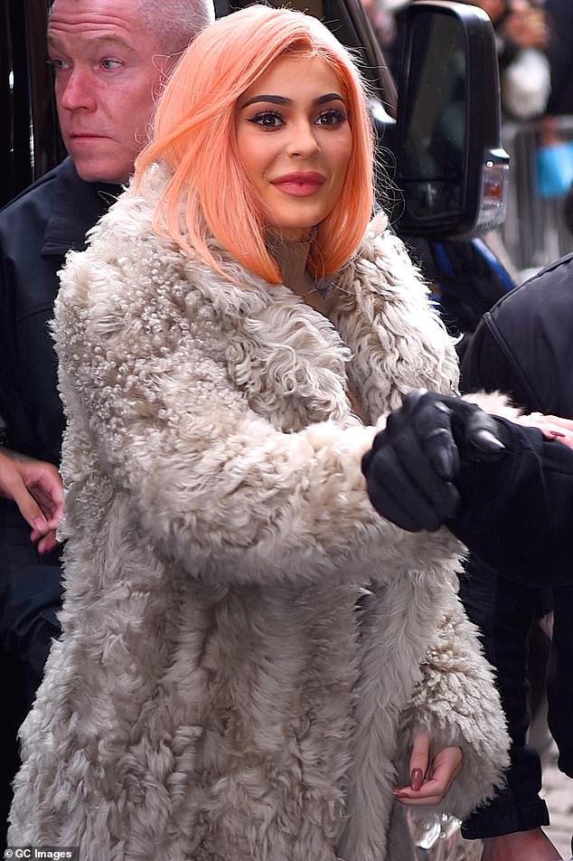 King Kylie is in reference to the media personality's alter ego where she often sported bold hair colors and makeup around 2015; Kylie seen in 2017 in NYC