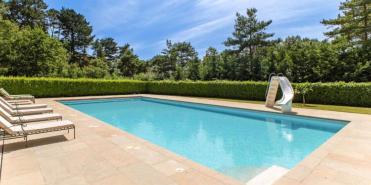 Former England star puts stunning Dorset mansion with sea views and heated pool on the market for £12MILLION