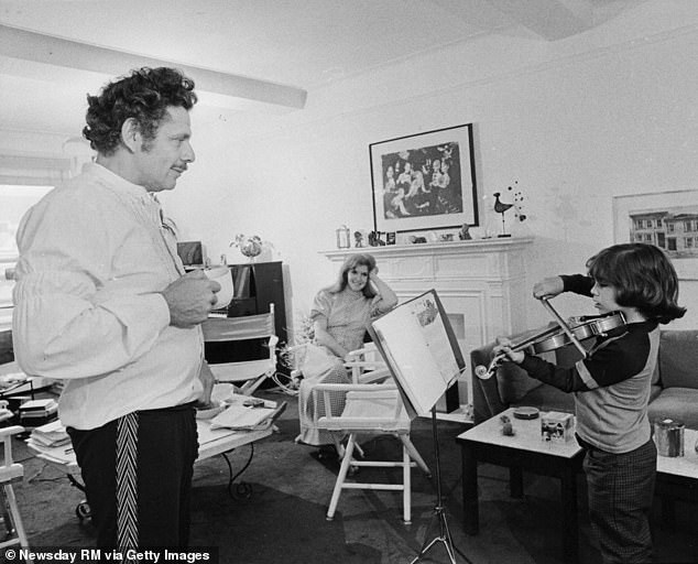 The actor shines a light on his upbringing as the son of comedy duo Jerry Stiller and Anne Meara in his documentary (pictured: Stiller practices the violin for his parents in 1972)