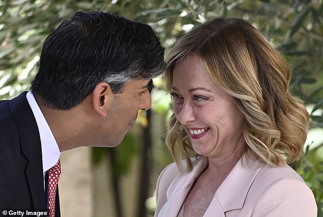British Prime Minister Rishi Sunak greets Italian Prime Minister Giorgia Meloni during a welcome ceremony on day one of the 50th G7 summit at Borgo Egnazia on June 13, 2024 in Fasano, Italy