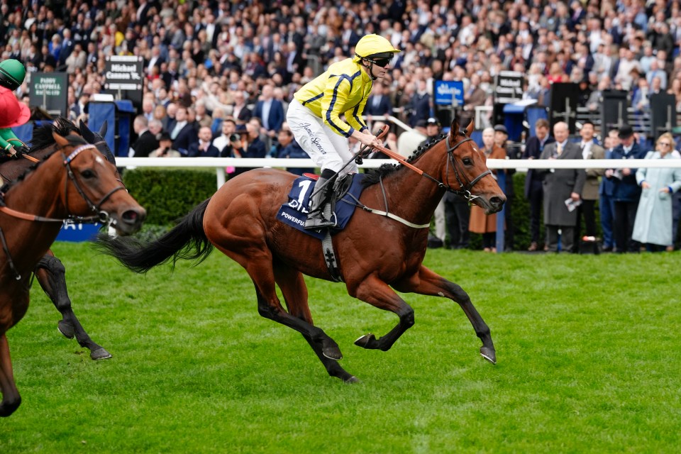 Jamie Spencer riding Powerful Glory in yellow silks winning The Qipco British Champions Sprint Stakes at Ascot Racecourse.