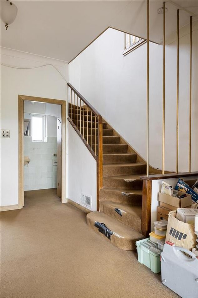 The listing photos show the carpeted stairs are taped up where they've worn thin, as well as piles of rubbish