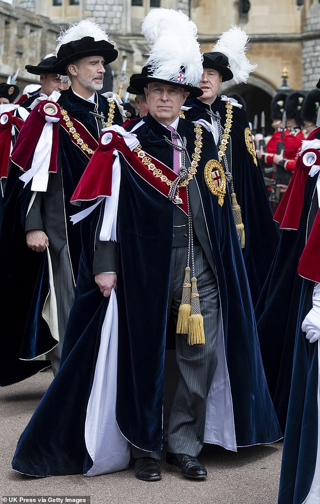 Prince Andrew at the Order of the Garter service in 2019 outside St George's Chapel in Windsor - he will now relinquish his Knight of the Garter status, as well as the title of Duke of York