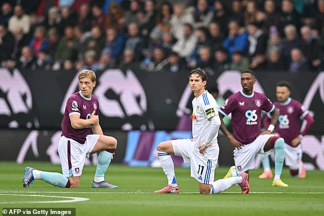 The gesture was made in support of the Premier League's No Room For Racism campaign