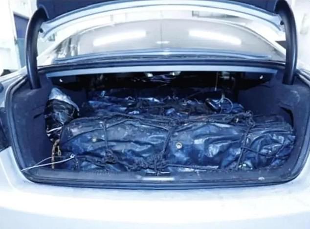 The huge stash of cocaine in the back of a car. The drugs were contained in waterproof parcels