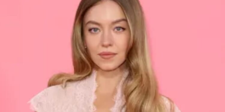 Sydney Sweeney looks sensational as she poses in pink silk and lace dress at London premiere of her new boxing movie