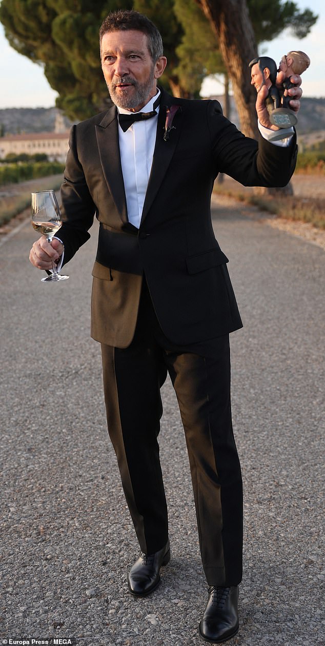 Antonio was dapper in a classic black tuxedo which was paired with a white dress shirt and black bowtie for the big day - with Melanie also in attendance at the nuptials