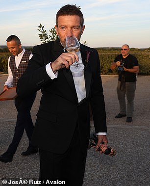 At one point, he could be seen holding up a glass of wine as he proudly celebrated his daughter's special milestone