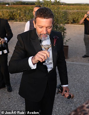 Antonio took time to enjoy a drink as he attended his daughter's wedding over the weekend