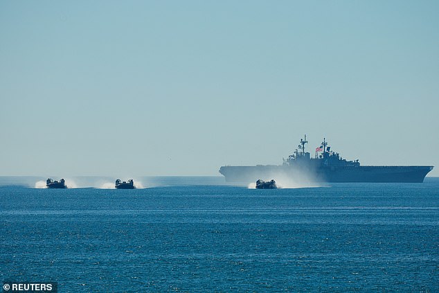 Large amphibious assault vehicles, named Navy Landing Craft Air Cushions (pictured), also took part in the visually stunning demonstrations