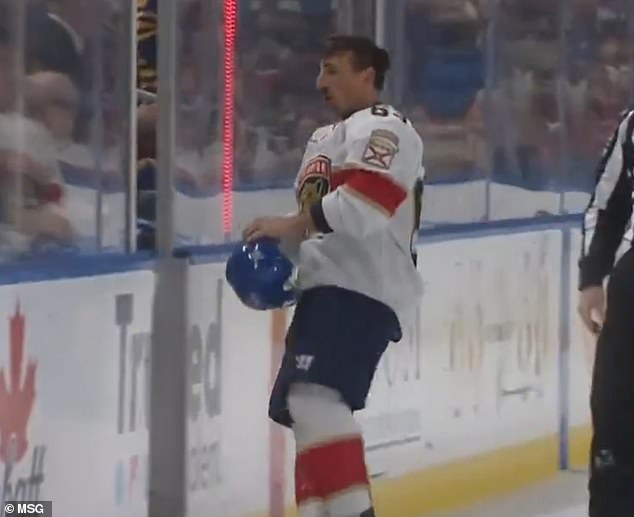 Marchand skated off the ice with Dahlin's helmet before he began ripping it up