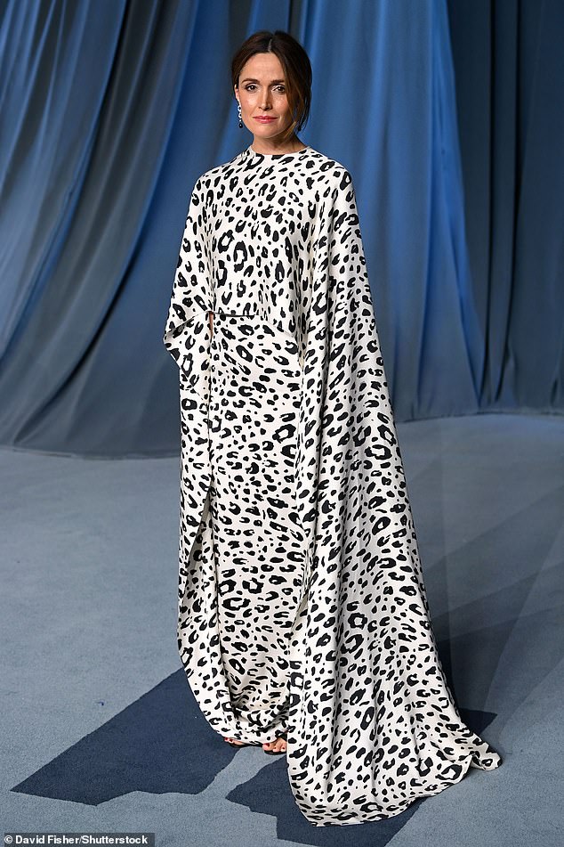 Rose Byrne showed off her sense of style in a black and white-patterned dress with caped sleeves and also donned a pair of open-toed black heels