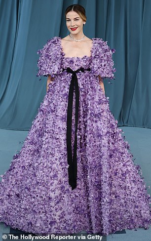 Michelle Monoghan made a statement on the red carpet in a purple flower gown with a high waist and ribbon tied into a black bow at the front