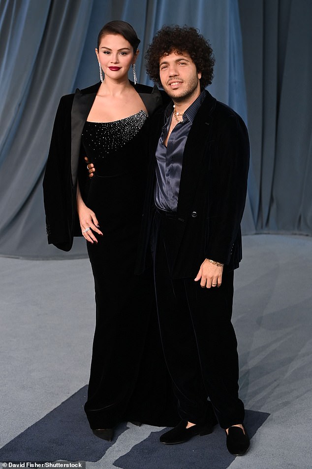 The billionaire, wearing an elegant black gown, cozied up to her husband Benny Blanco, 37