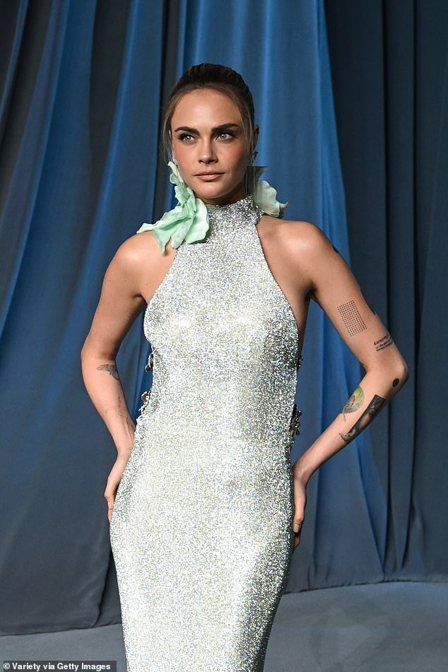 She showed off her many inkings in the dress