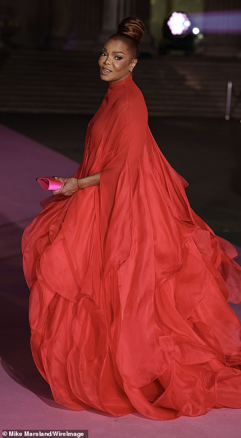 She turned heads in a huge bright red ruffled gown
