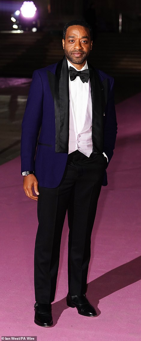 Bridget Jones: Mad About The Boy actor Chiwetel Ejiofor looked dapper as he arrived on the red carpet in a navy and black satin tux