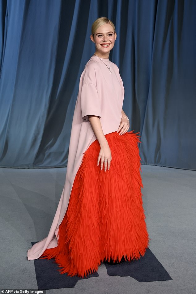 American actress Elle Fanning, 27, also suffered from a rare fashion miss as she opted for a Balenciaga ensemble with a bizarre red feathered skirt