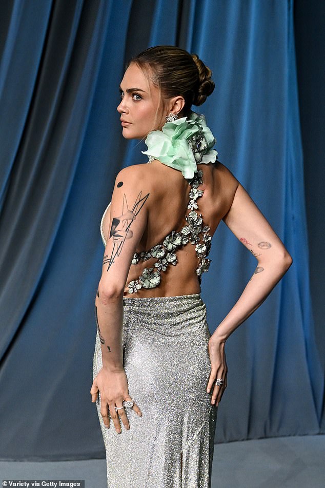 The back featured beautiful flower detailing - however a blue ruffle detail sat awkwardly on her neck