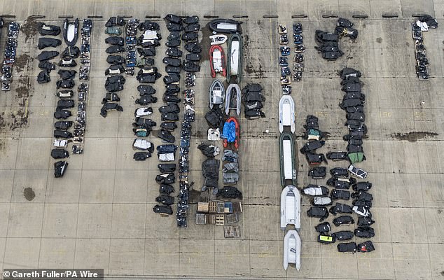 A large number of small boats used by people thought to be migrants, pictured at a warehouse facility in Dover, Kent