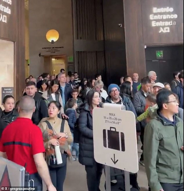 Tourists pictured being escorted from the Louvre on Sunday after thieves arrived on scooters to swipe priceless historical items in an audacious heist