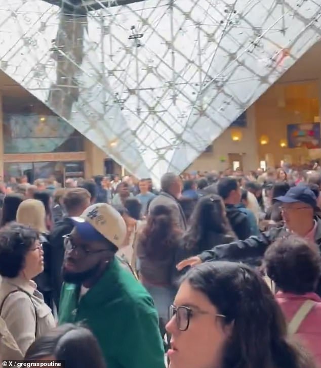 Panicked visitors attempt to make their way out of the iconic museum following the robbery