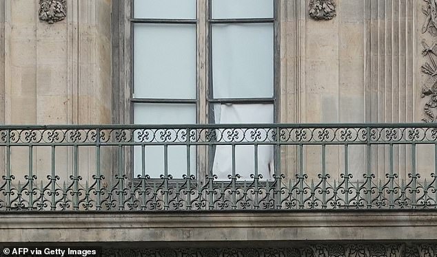 A window of the Louvre appears to be destroyed in photos taken following the theft