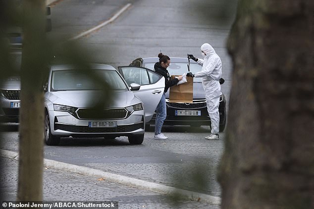 Forensics crews were seen collecting evidence from the elevator used by the robbers
