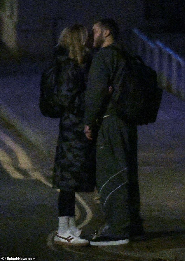 During their walk home they stopped and shared a passionate kiss at the side of the road