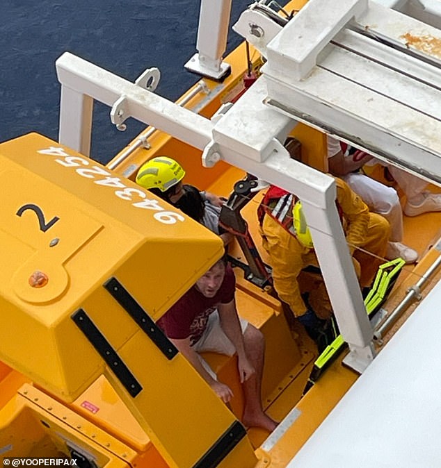 The father's heroic actions saved his daughter's life (Pictured: the rescue boat docking after the 20-minute ordeal)