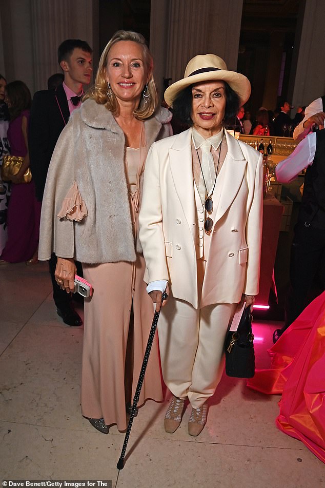 Former model Bianca (right) looked effortlessly stylish in a cream three piece suit which she teamed with fedora while walking with the help of a cane