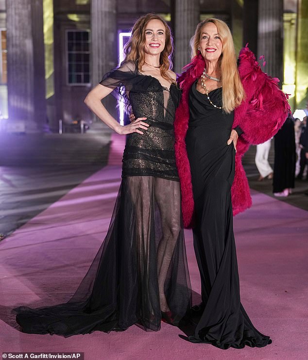 Mother and daughter both stunning in figure-hugging black gowns as they hit the red carpet