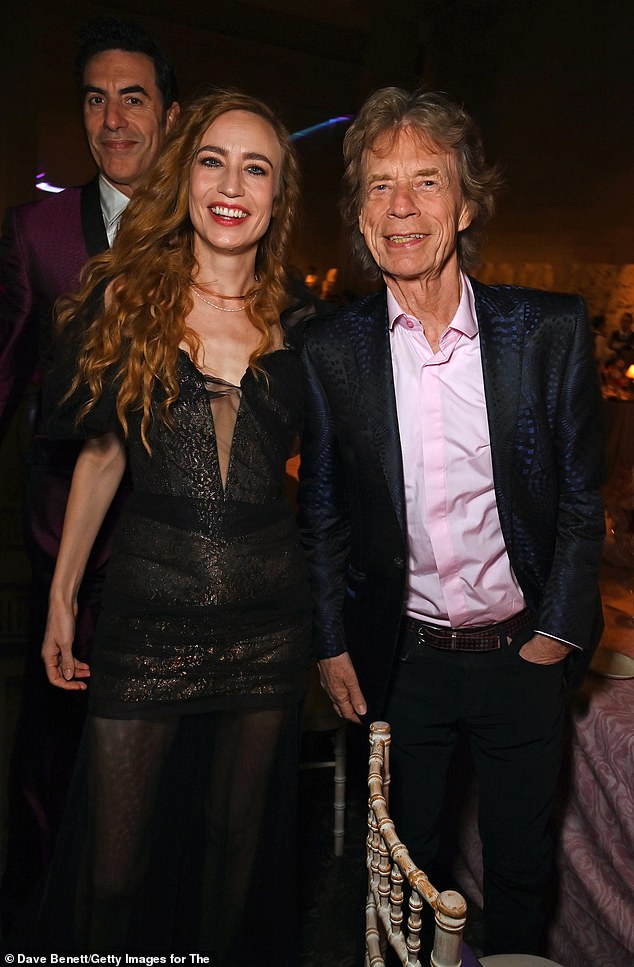 Mick beamed as he cosied up to daughter Elizabeth