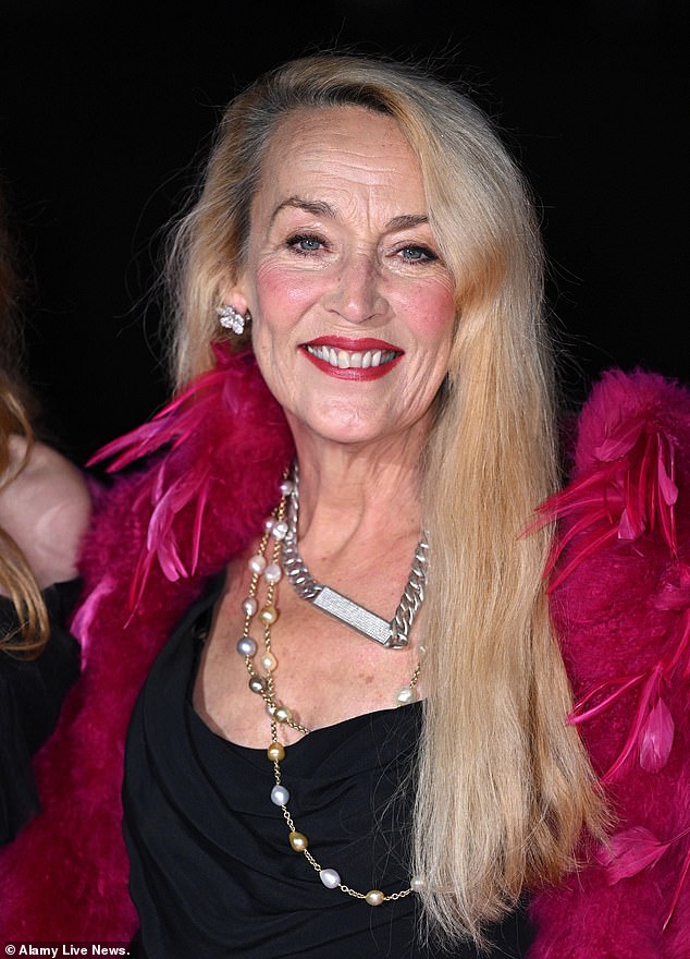 Jerry teamed her black gown with red lipstick and a feathered coat