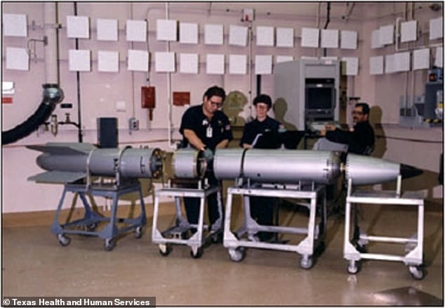 NNSA's federal staff oversees some 60,000 contractors maintaining and testing weapons at national laboratories and other locations across the United States. Pictured: Employees handling a weapon at Pantex facility in Texas