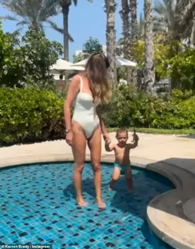 Karen looked incredible as she showcased her weight loss in a white one-piece as she paddled in the swimming pool during a lavish holiday