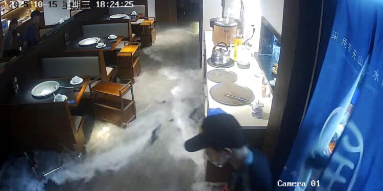Shocking moment Chinese restaurant’s giant fish tank BURSTS swamping dining room with water and live seafood