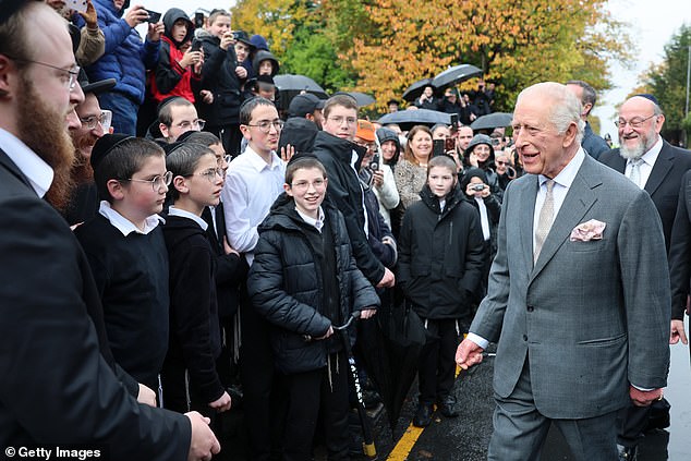 King Charles III meets people outside Heaton Park Hebrew Congregation Synagogue today