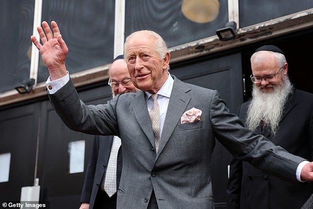 King Charles III waves to the public at Heaton Park Hebrew Congregation Synagogue today