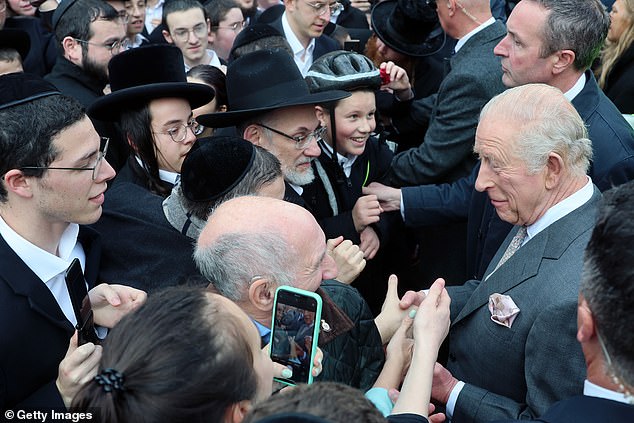 King Charles III meets people outside Heaton Park Hebrew Congregation Synagogue today