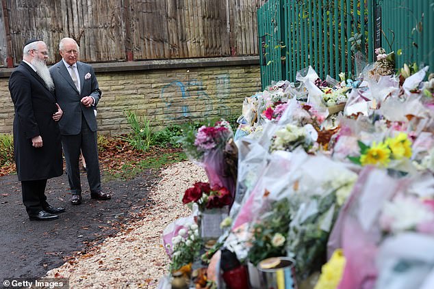 King Charles III views tributes on a visit to Heaton Park Hebrew Congregation Synagogue today