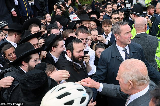 King Charles III meets people outside Heaton Park Hebrew Congregation Synagogue today