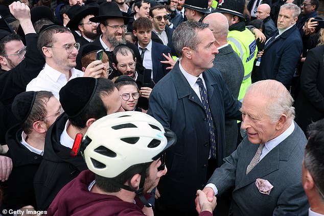 King Charles III meets people outside Heaton Park Hebrew Congregation Synagogue today