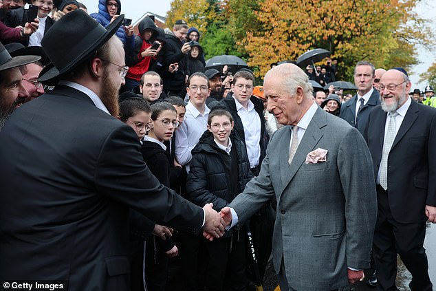 King Charles III meets people outside Heaton Park Hebrew Congregation Synagogue today